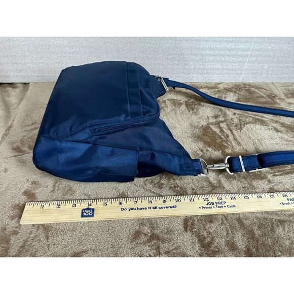 Travel on antitheft classic Crossbody bucket bag navy blue new without tags 
￼ - Picture 8 of 10